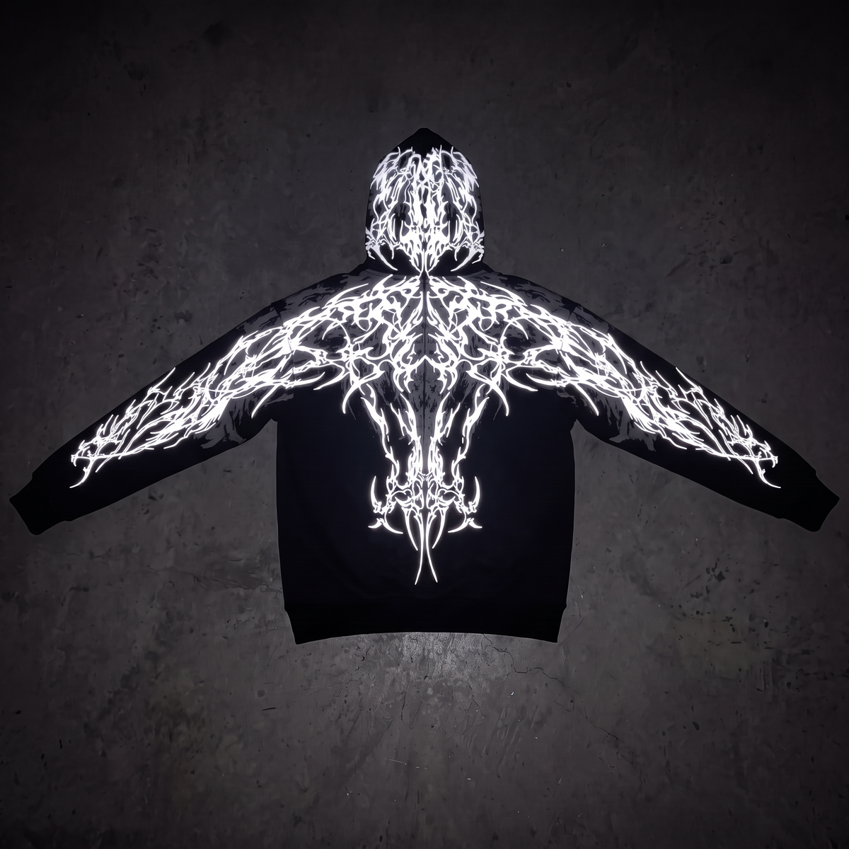 Thorn Reflective Hoodie flat lay, reflective print lit by flash