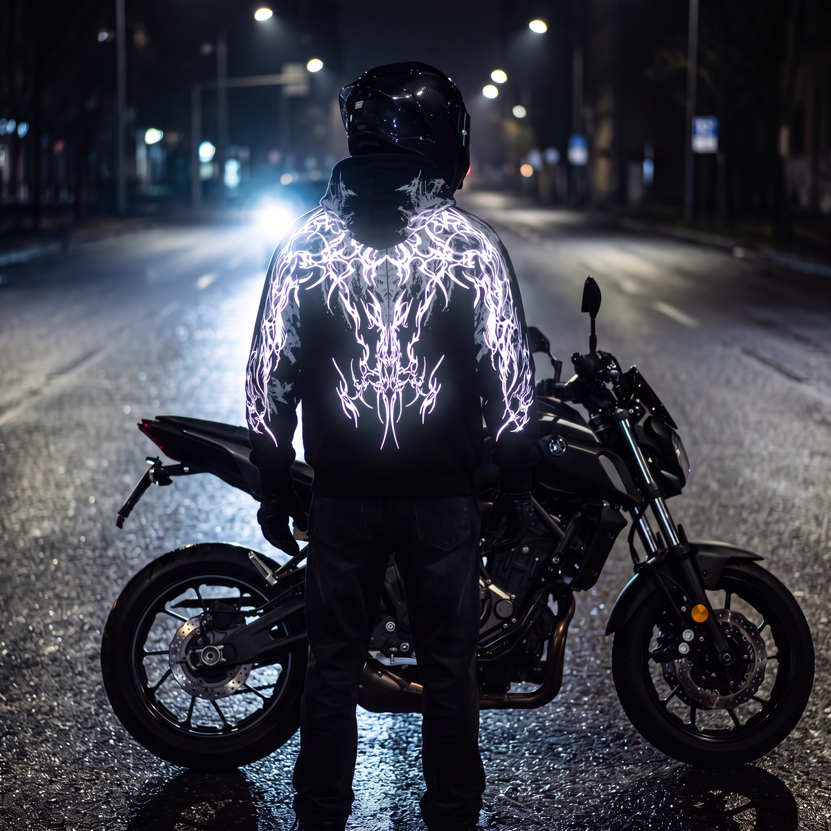 Rider at night with the reflective print lit by headlights