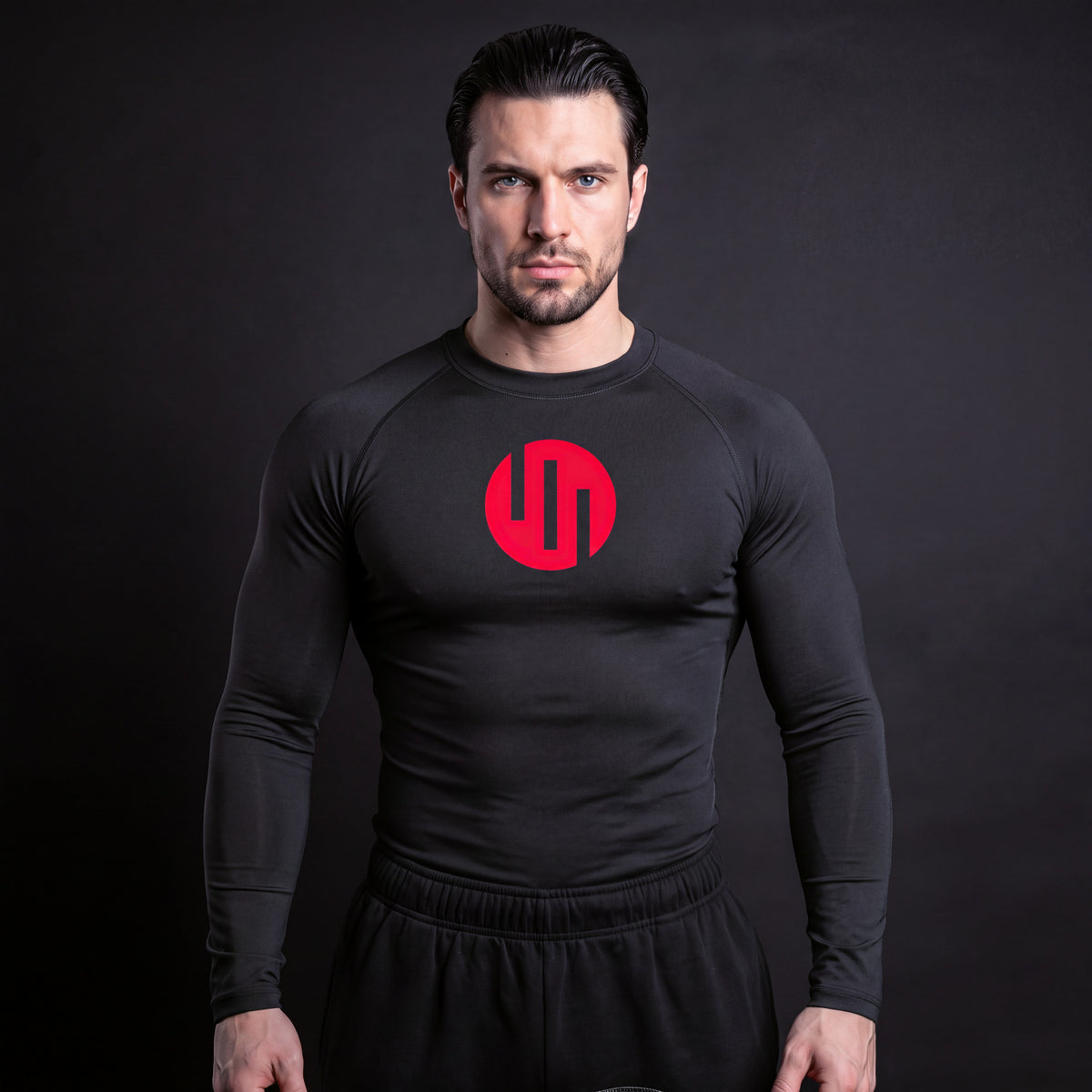 Viltrumite Compression Shirt Black & Red long sleeve on model, front view